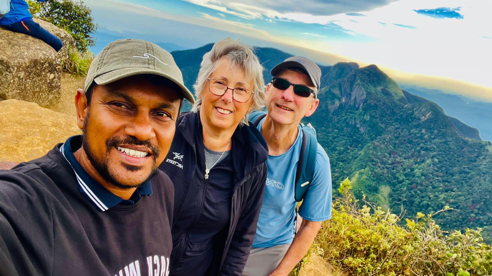 Travellers taking a selfie at a mountain viewpoint