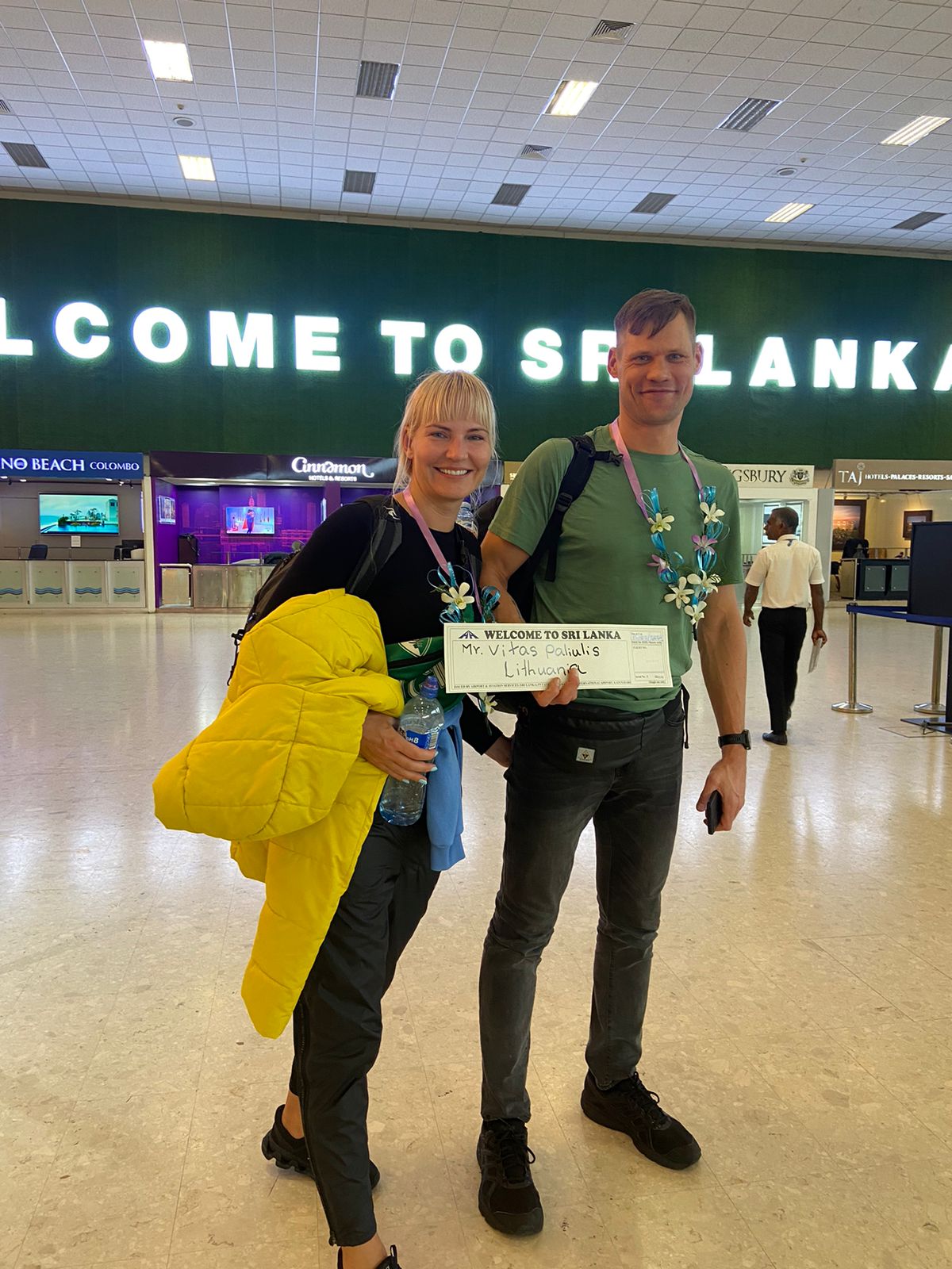 Travellers arriving at the airport with luggage