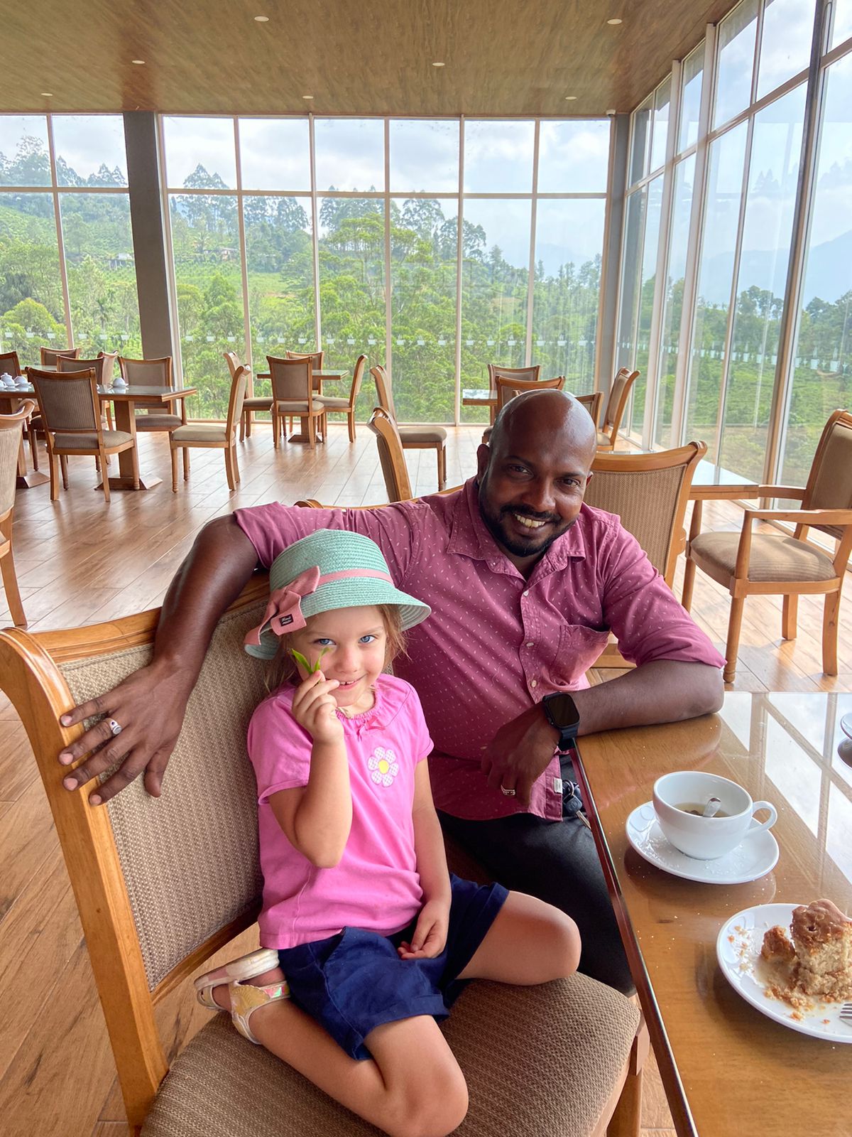 Two travellers sitting at a cafe table
