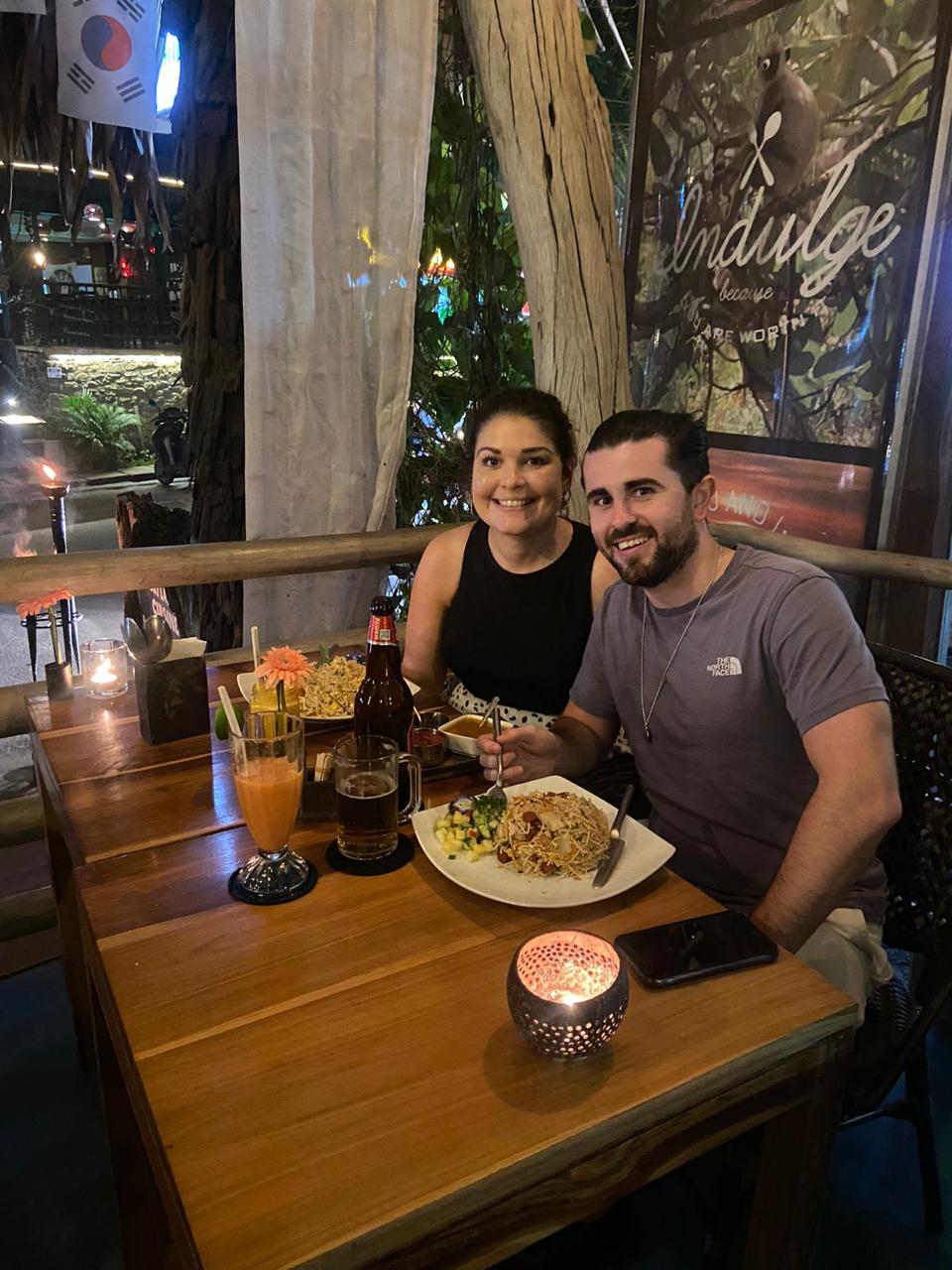 Two travellers sharing a meal at a restaurant
