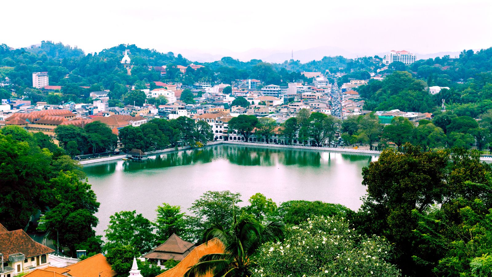 Kandy Lake framed by the city and surrounding green hills