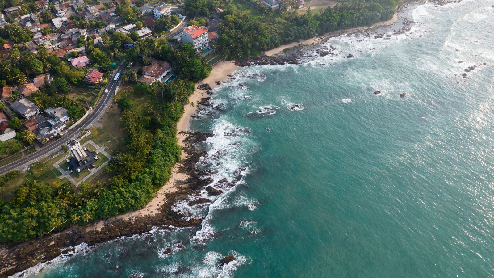 Aerial view of Tangalle’s coastline, greenery and turquoise water